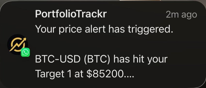 A PortfolioTrackr price alert as received on WhatsApp: the ticker and the target level it reached